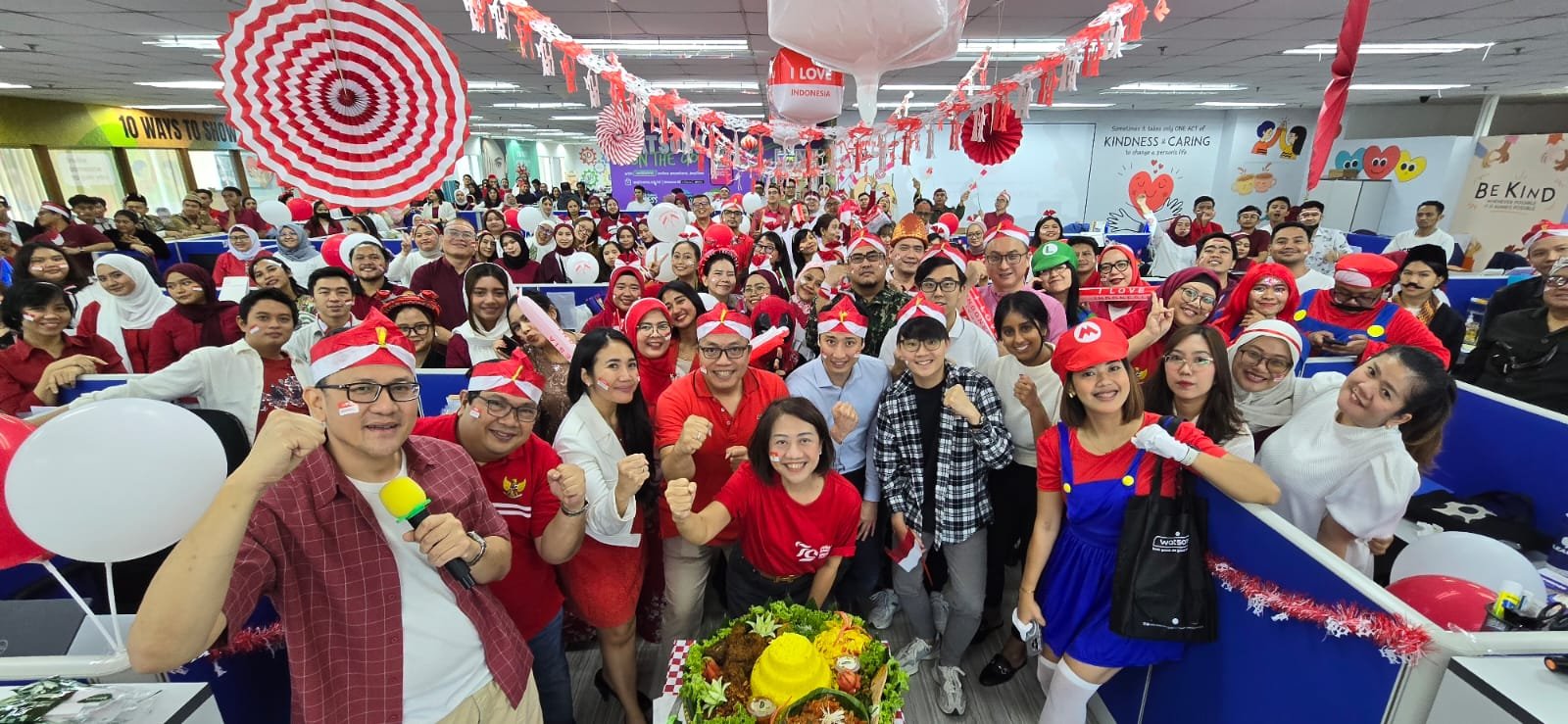 Group of people celebrating with red and white decorations.