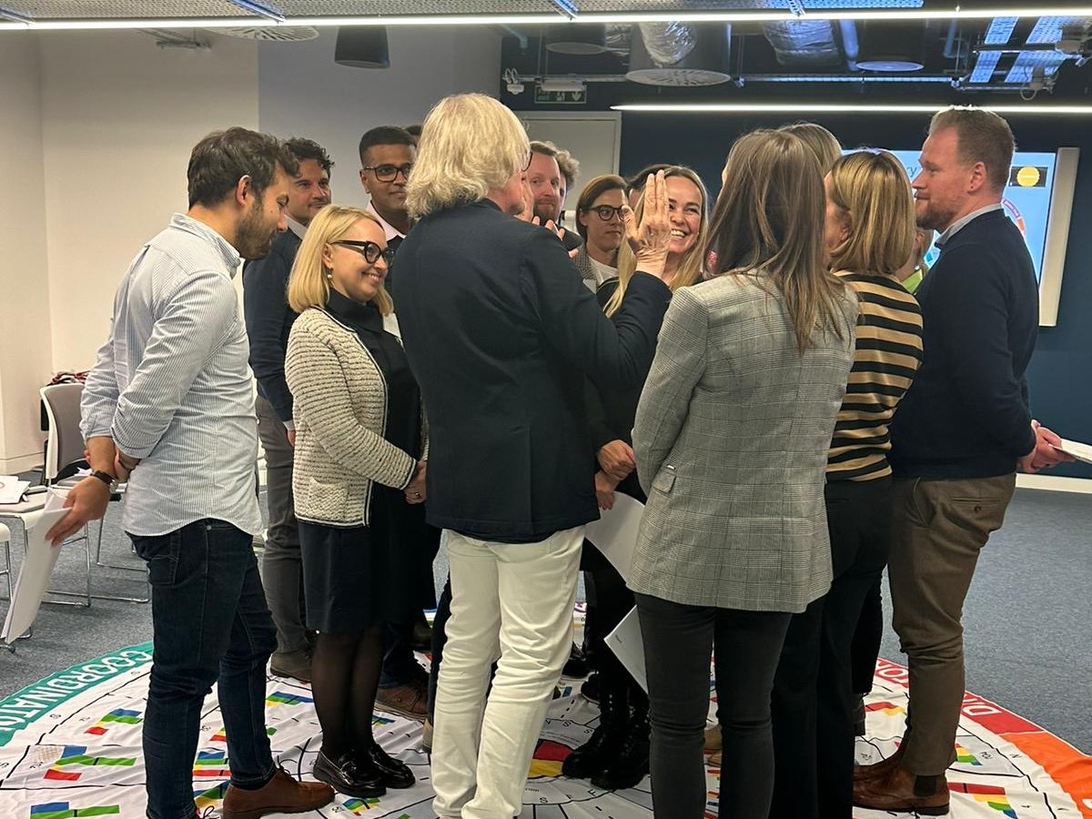 People in a circle, discussing something.