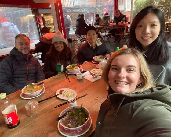 People at a restaurant with food on the table.
