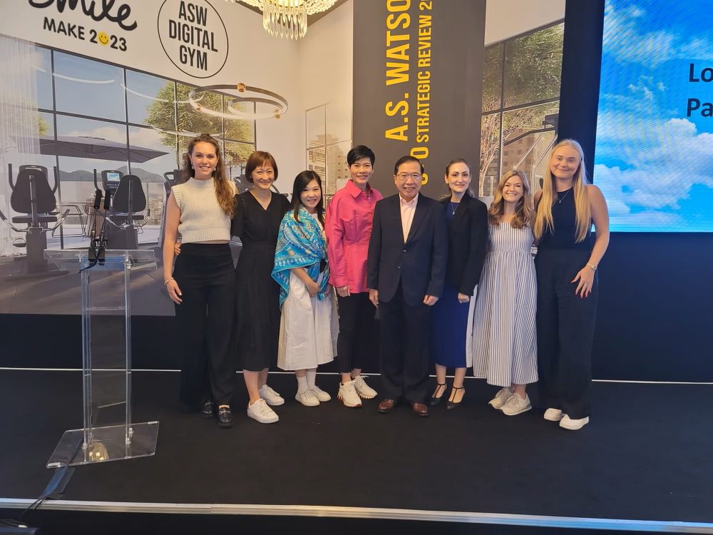 Group of people posing for a photo at an event.