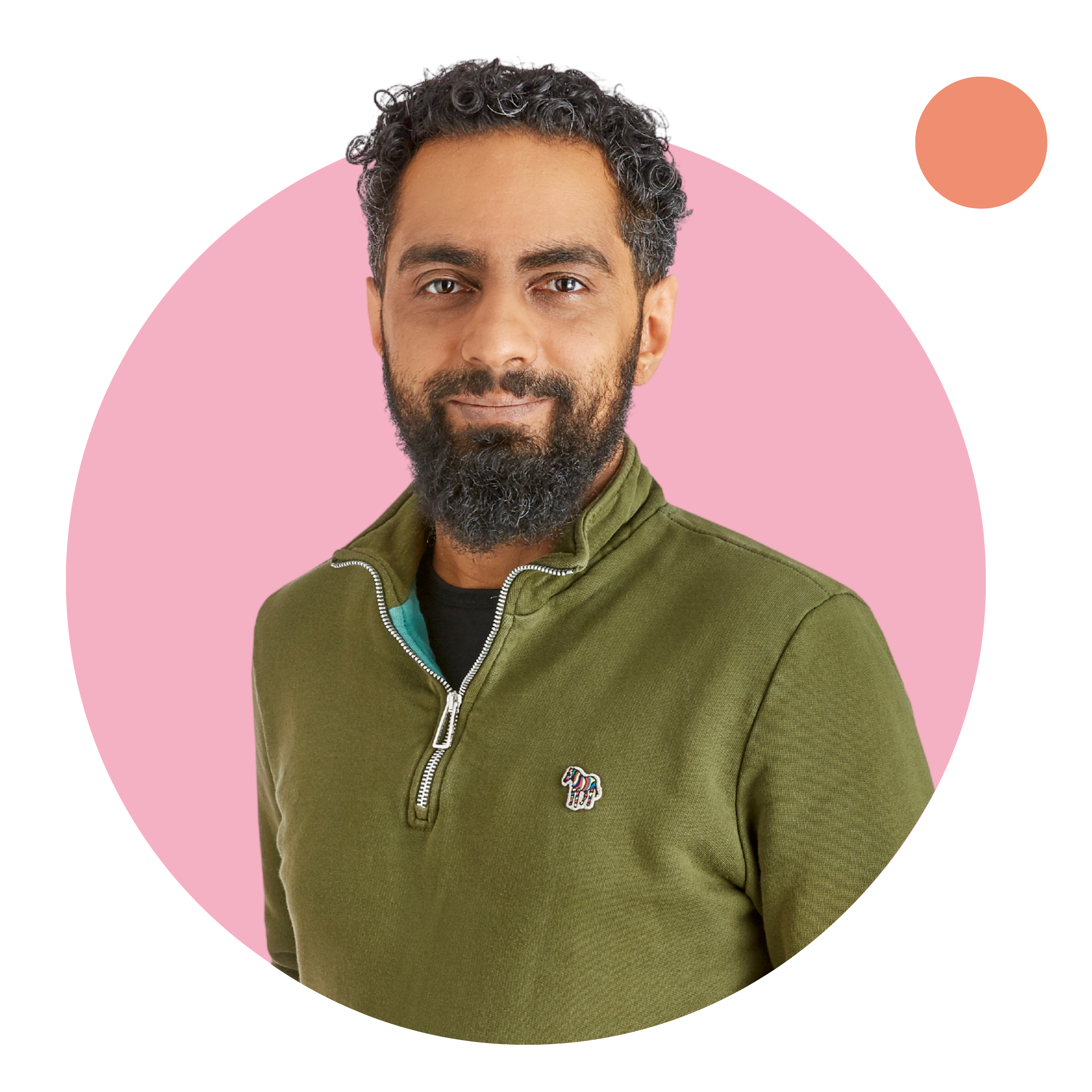 Man with a beard in a green sweater.