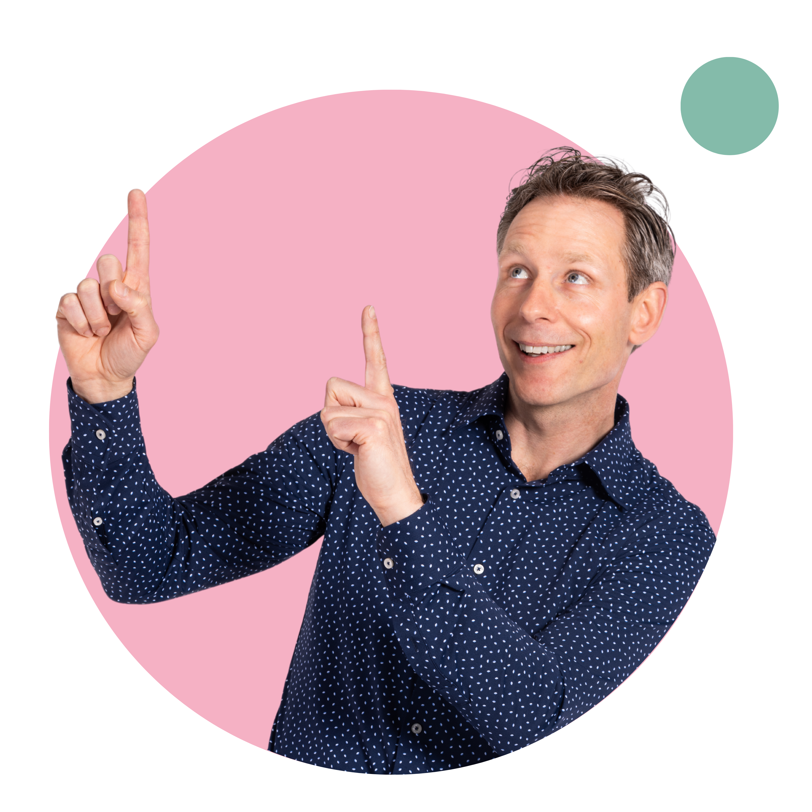 Man pointing upward with a smile. He is wearing a blue polka dot shirt.